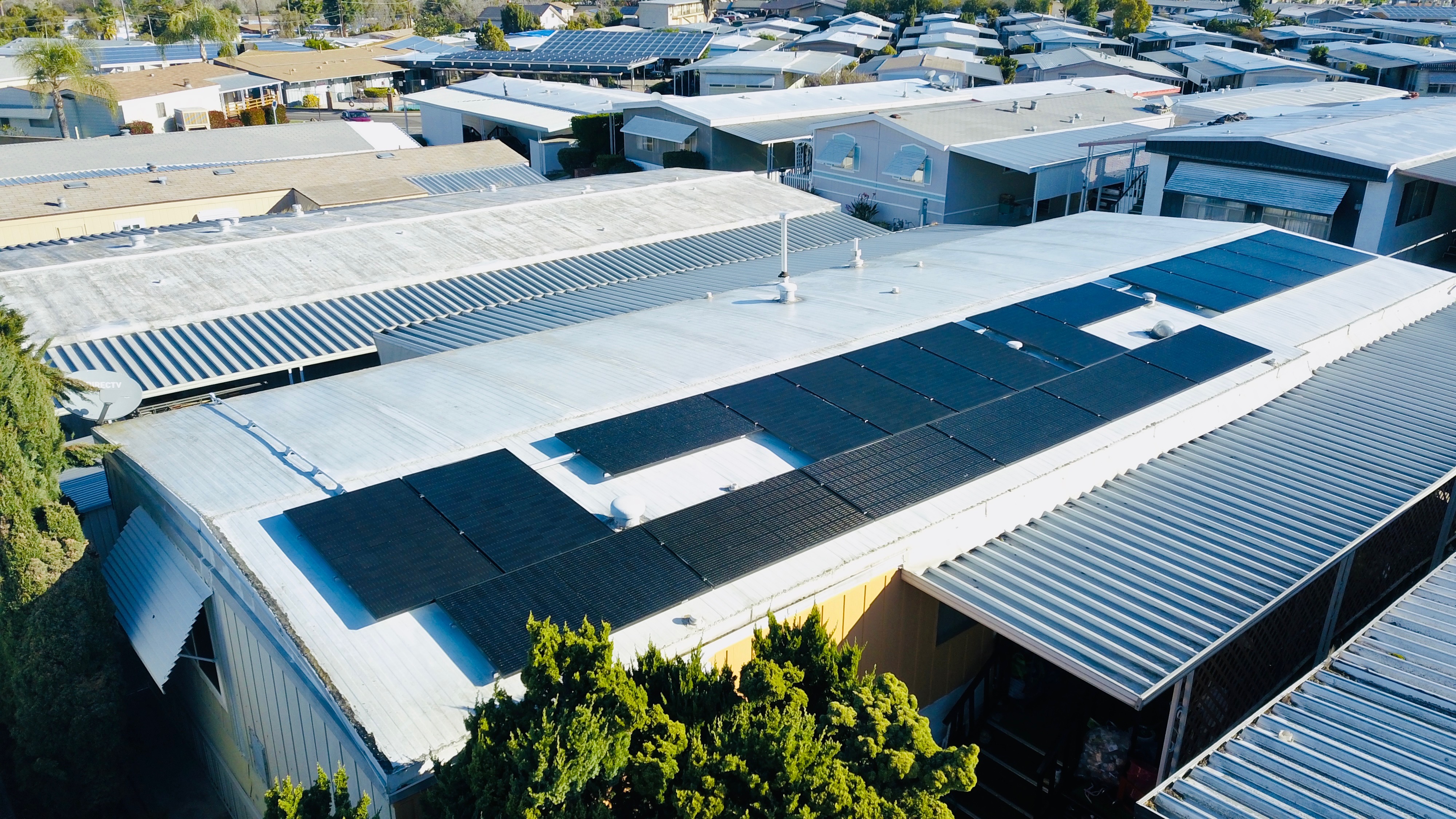 Rooftop solar panel installation on a manufactured home in Southern California, showcasing energy-efficient design and clean energy solutions.